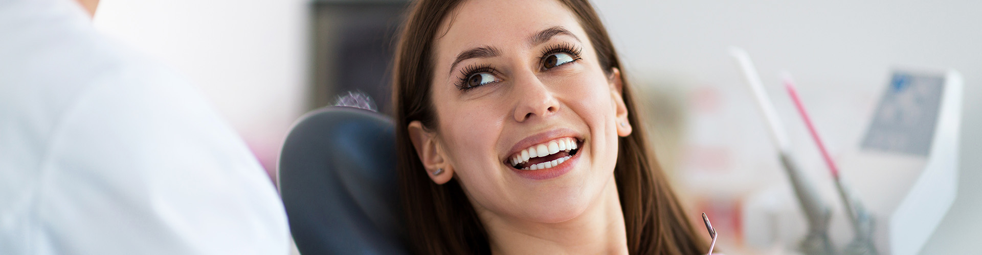 woman smiling up at dentist