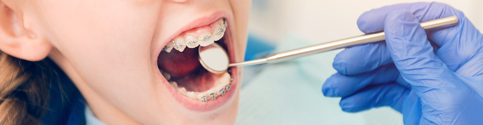dental mirror being held in child's mouth