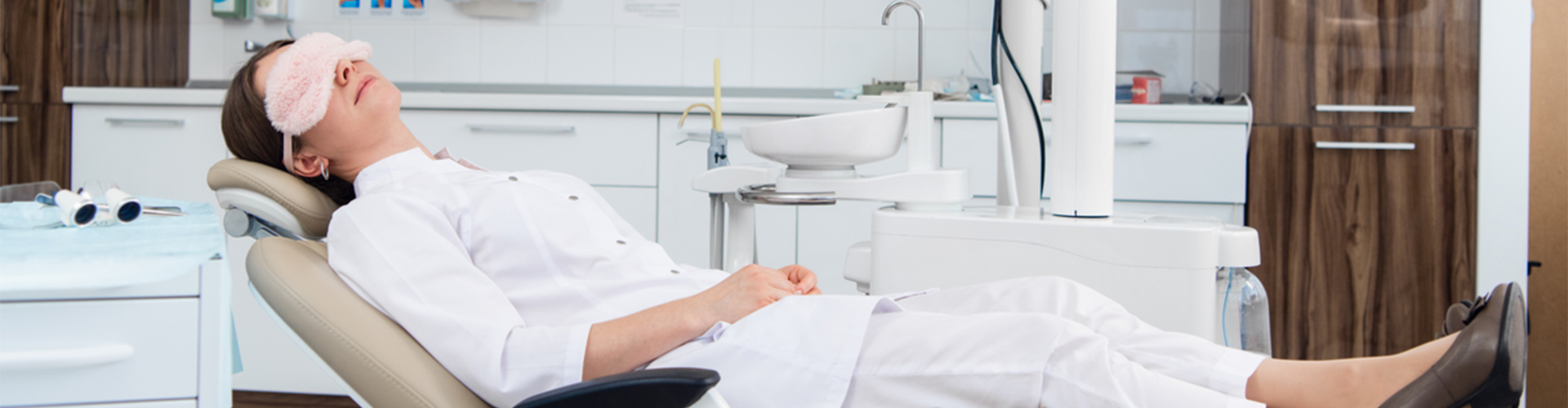 woman sleeping in dental chair