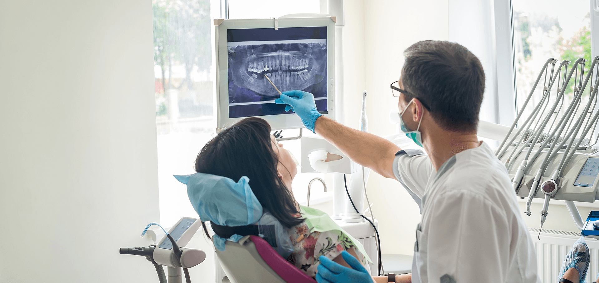 Dentist showing a patient xray results
