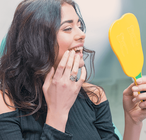 Female checking out her veneers