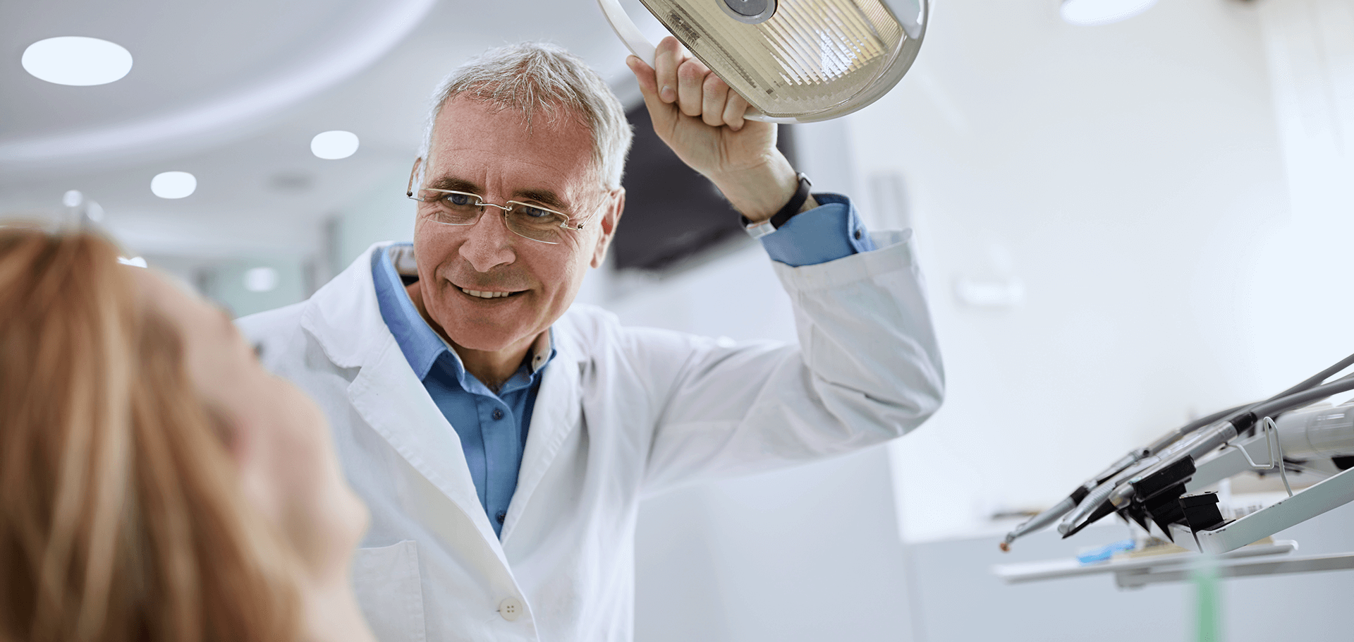 Dentist looking at a patient's teeth