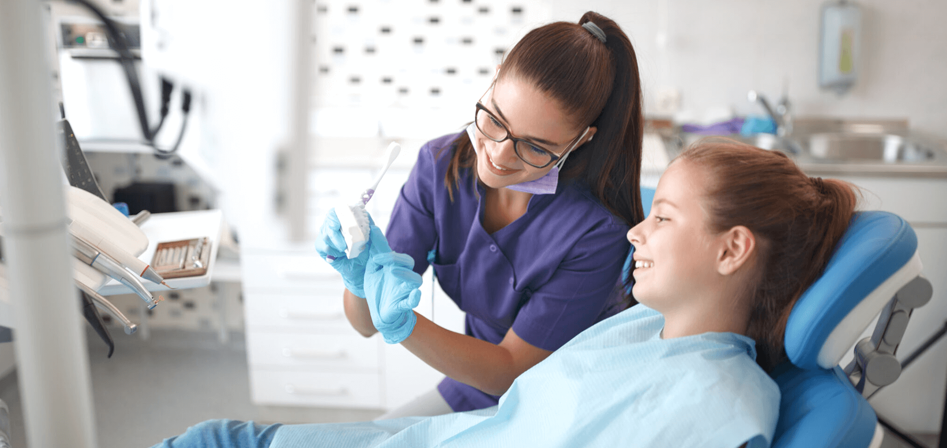 Dentist explaining the procedure to a kid