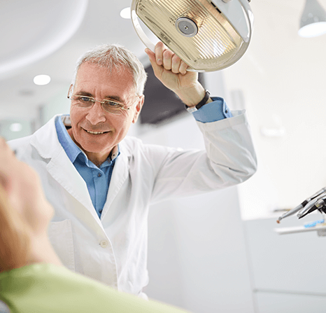 Patient getting her tooth extracted