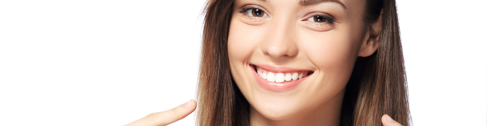 woman pointing to her smile