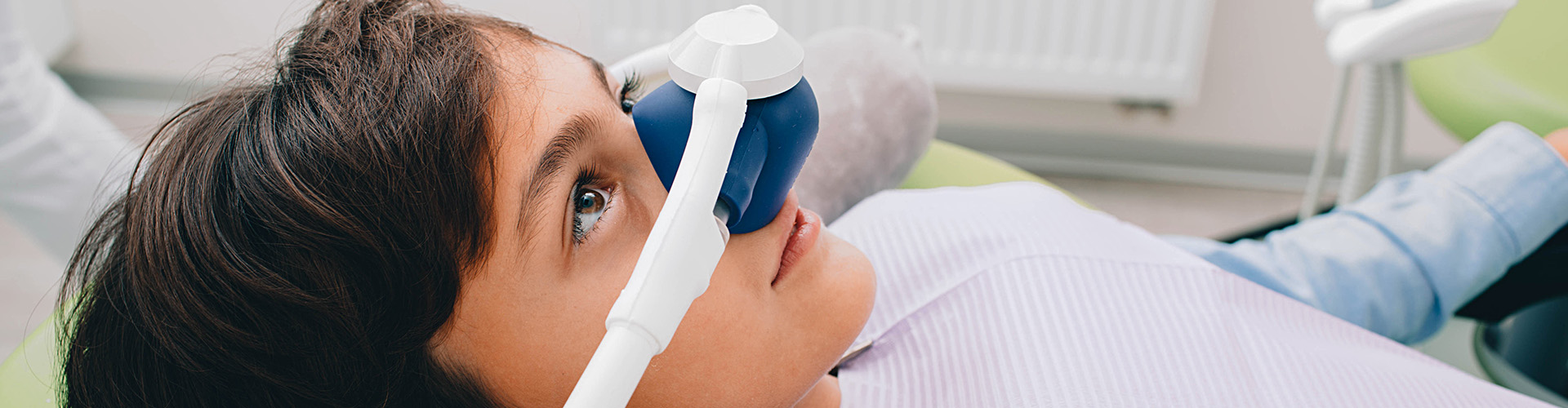 boy with sedation mask on his nose